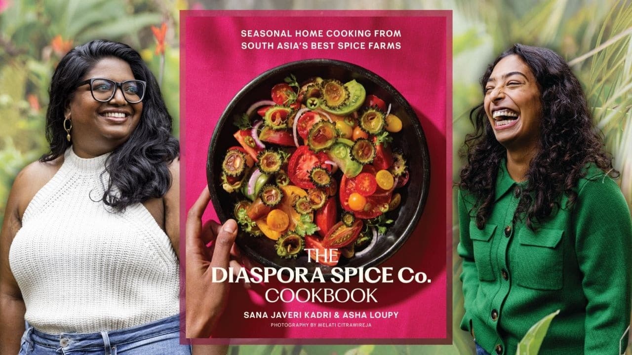 Photo of Authors Sana Javeri Kadri and Asha Loupy with their book The Diaspora Spice Co. Cookbook. Online Author Talk on June 23rd at 2:00pm