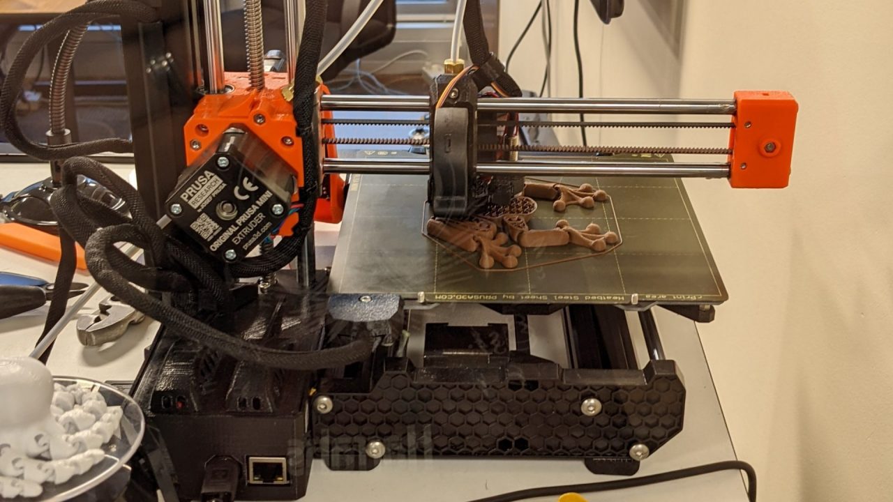 The library’s Original Prusa MINI+ 3D printer mid-print.